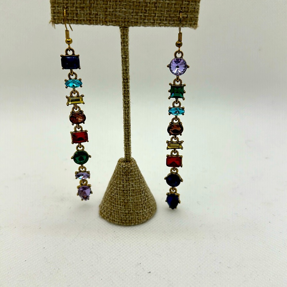 Dangling gemstone earrings.
